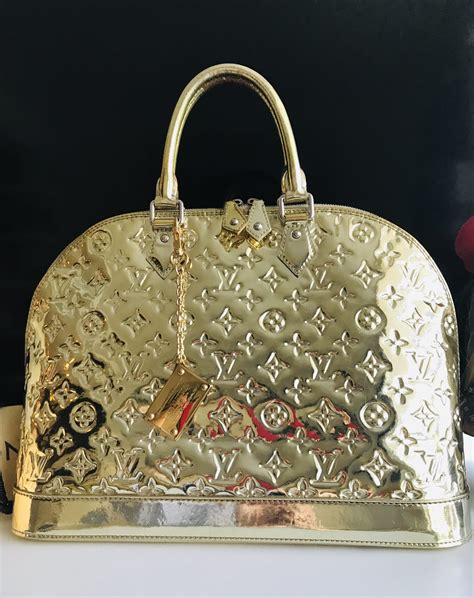 lv gold bag|louis vuitton gold purse.